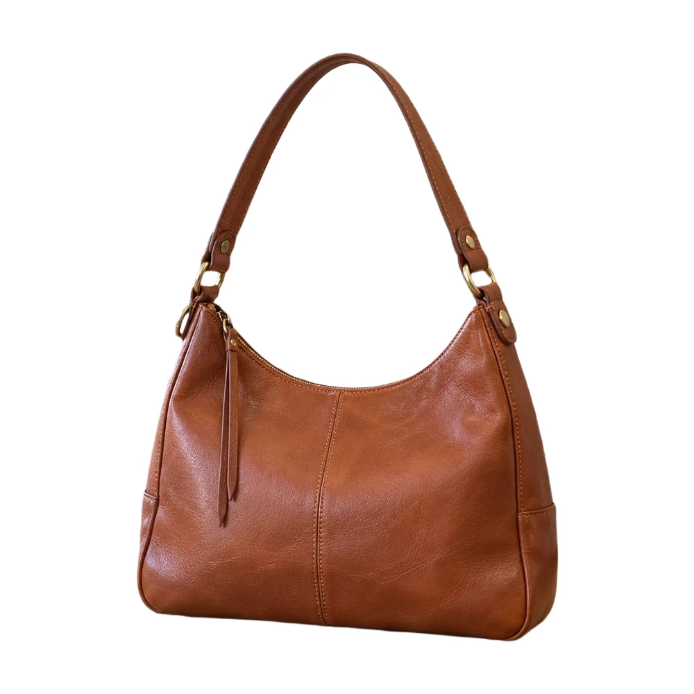 The same leather bag isolated on white, including the open handle